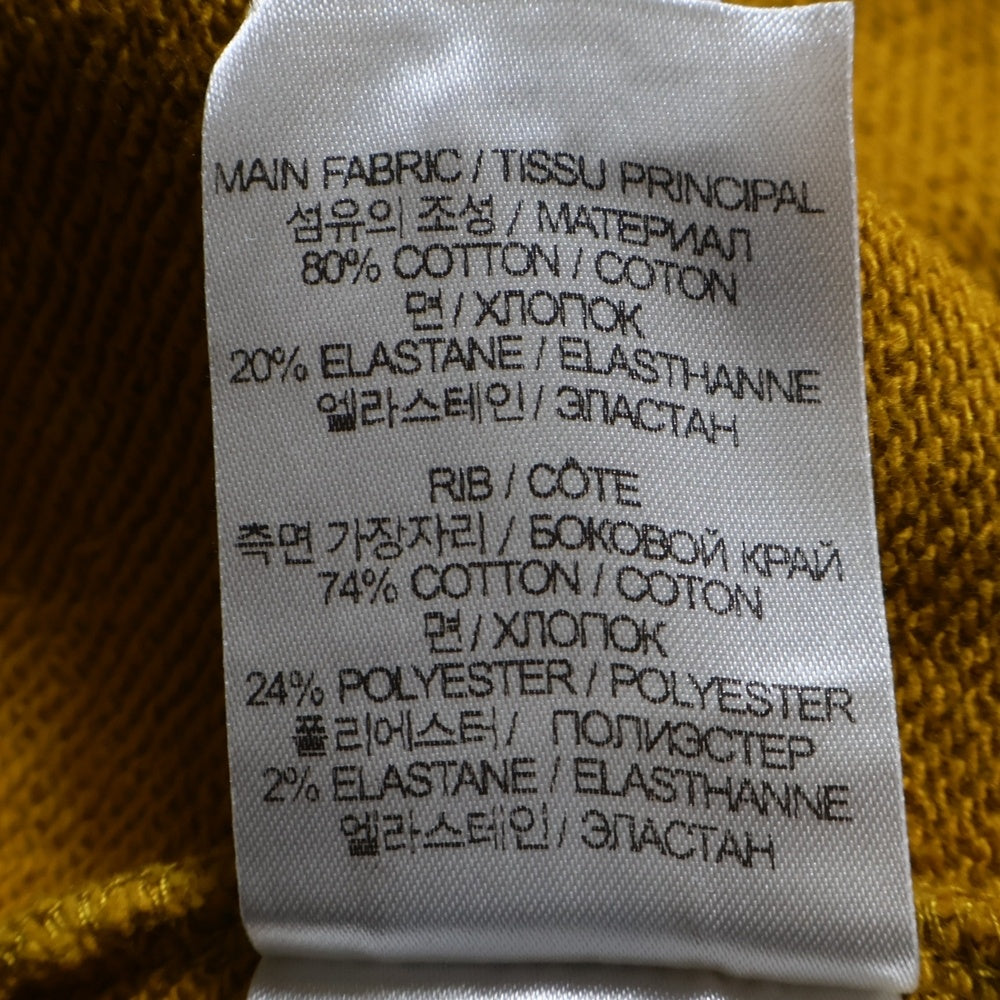 VTMNTS(ブイティーエムエヌティーエス) カレッジロゴ刺繍 プルオーバーパーカー スウェット イエロー VL16HD380M