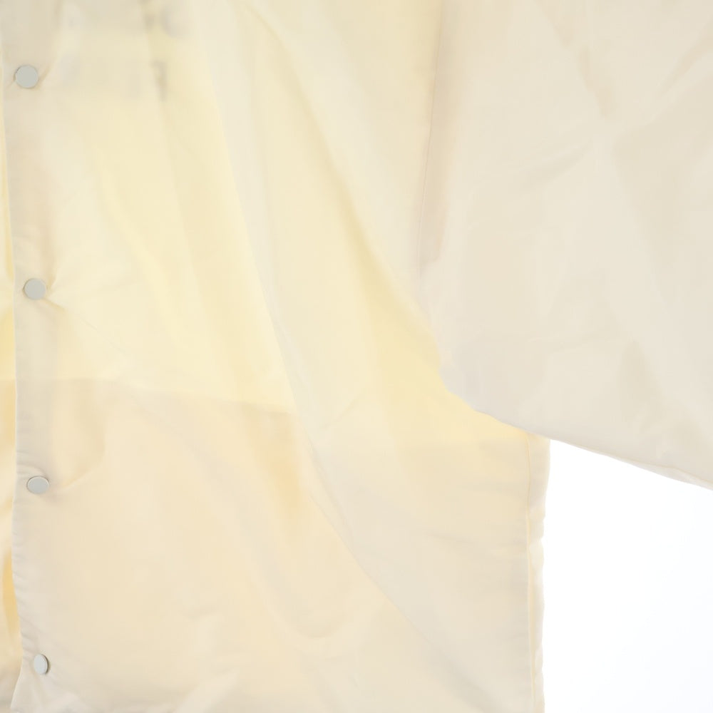 FEAR OF GOD ESSENTIALS(フィアオブゴッド エッセンシャルズ) NYLON COACH JACKET バックロゴ ナイロンコーチジャケット アイボリー
