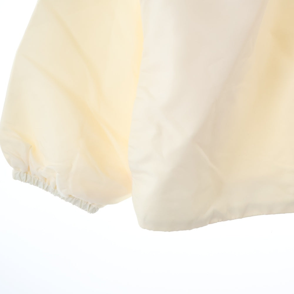 FEAR OF GOD ESSENTIALS(フィアオブゴッド エッセンシャルズ) NYLON COACH JACKET バックロゴ ナイロンコーチジャケット アイボリー