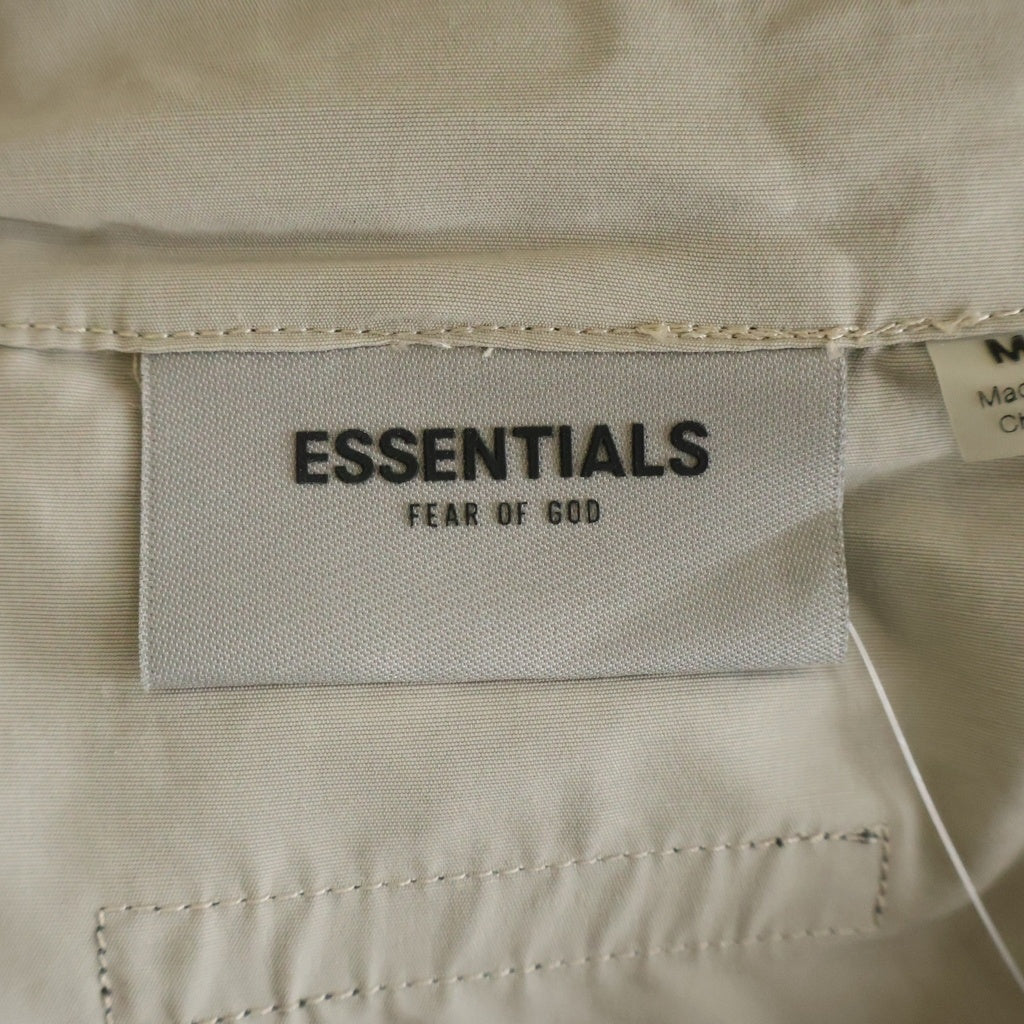 FEAR OF GOD ESSENTIALS(フィアオブゴッド エッセンシャルズ) HALF ZIP NYLON JACKET リフレクターロゴ ハーフジップ ナイロントラックジャケット ベージュ