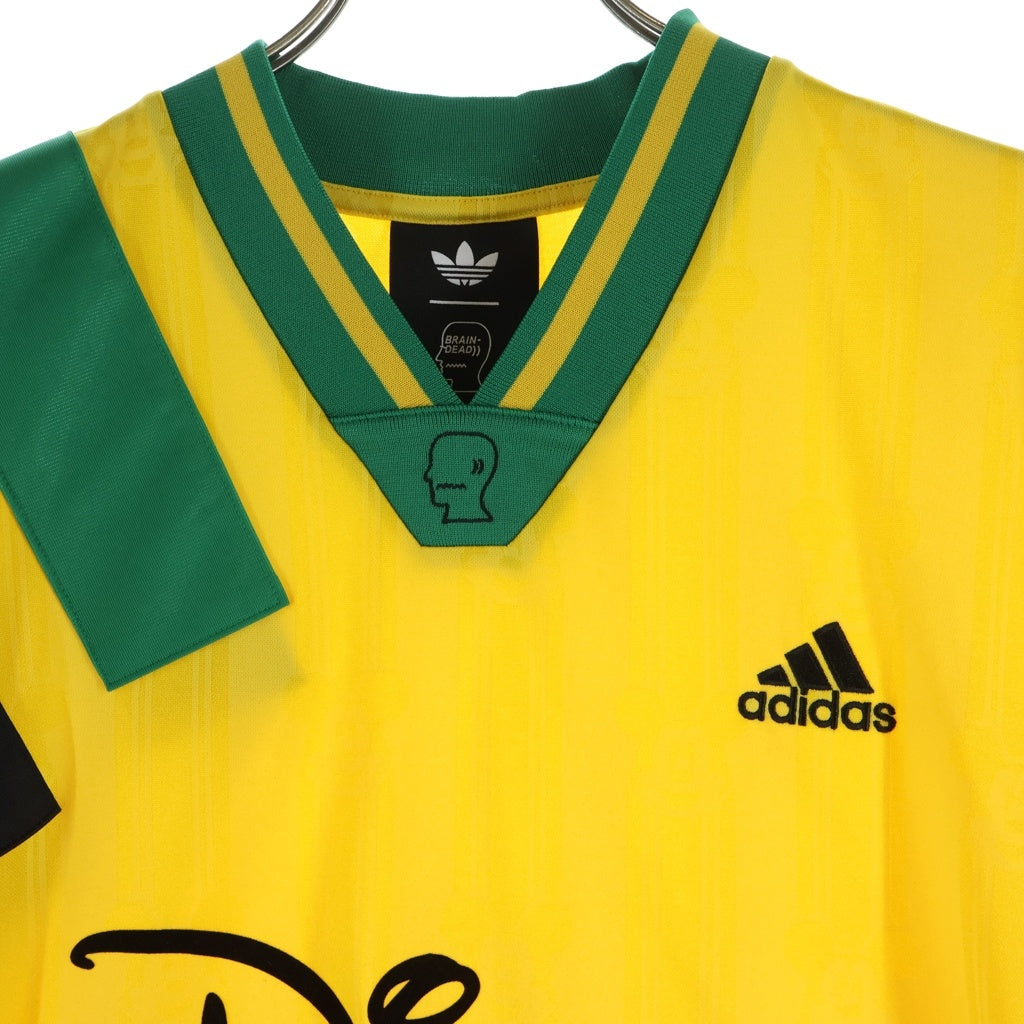 BRAIN-DEAD(ブレインデッド) ×adidas ×Disney Football Jersey アディダス ディズニー フットボールシャツ 半袖Tシャツ イエロー KR5195