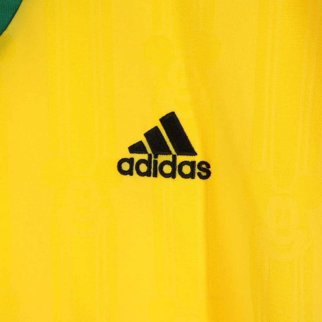 BRAIN-DEAD(ブレインデッド) ×adidas ×Disney Football Jersey アディダス ディズニー フットボールシャツ 半袖Tシャツ イエロー KR5195