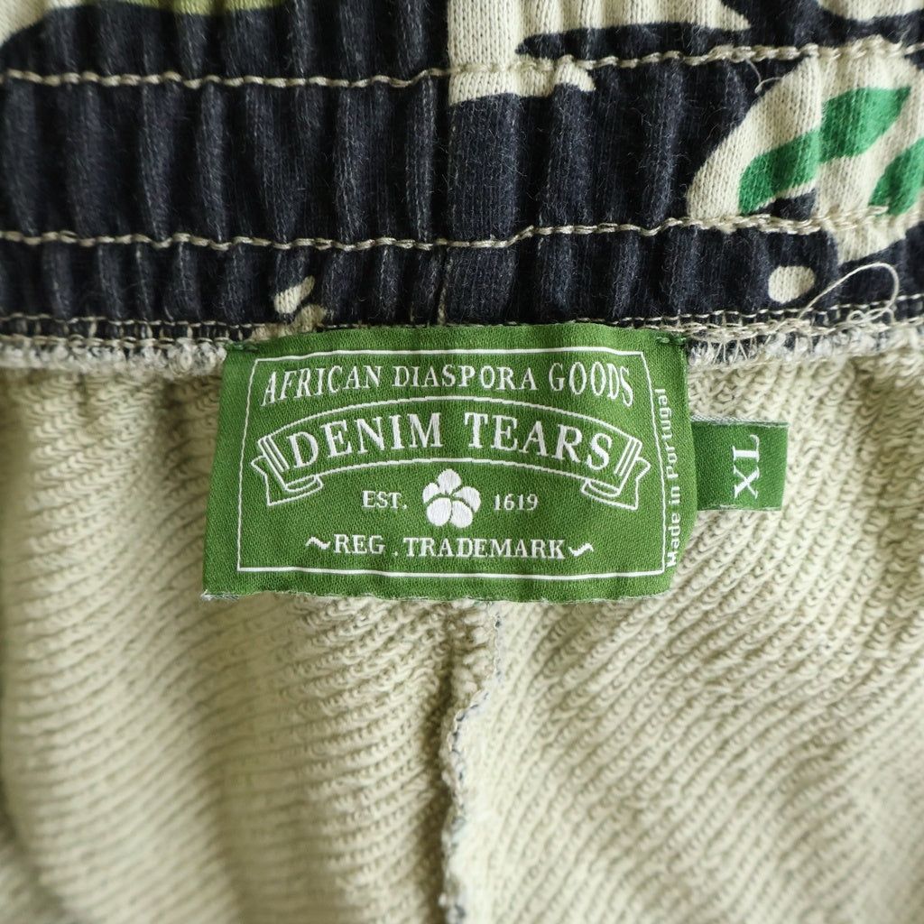 DENIM TEARS(デニムティアーズ) Cotton Wreath Sweatpants フラワー柄 カモ コットン スウェットパンツ カーキ