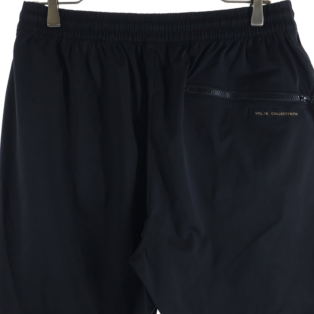 99%is(ナインティナインパーセントイズ) VOL.16 NN18-PT11 ZIP NYLON PANTS ジップデザイン ナイロンラバーロゴパンツ ブラック