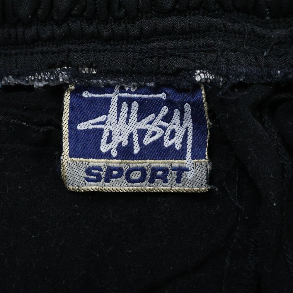STUSSY(ステューシー) 90's SPORT 裏地付きトラックパンツ ブラック/レッド