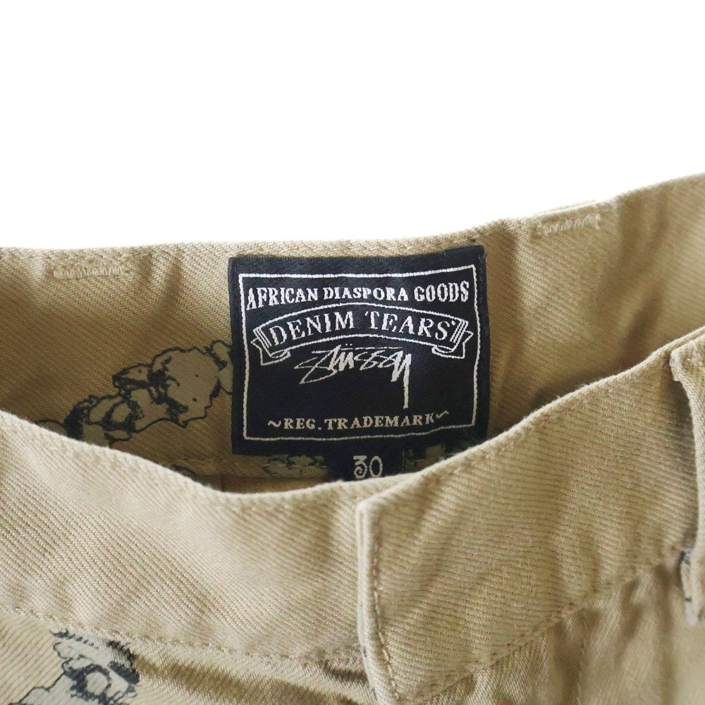 DENIM TEARS(デニムティアーズ) ×STUSSY DOUBLE S WREATH CHINO ステューシー ダブルエスチノパンツ ベージュ 25S316091