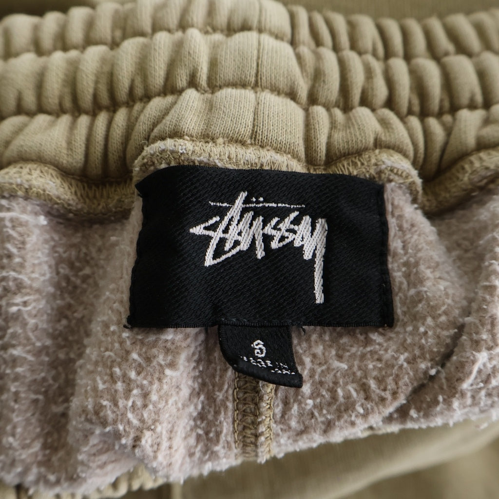 STUSSY(ステューシー) Fleece Pant Faded Graphic 116667 フェイデッド グラフィック ロゴ フリース スウェットパンツ ベージュ
