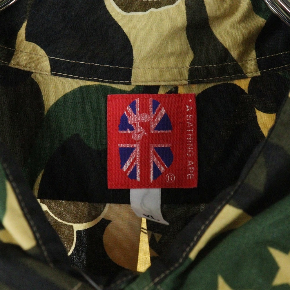 A BATHING APE(アベイシングエイプ) ×KAWS bendy 1st camo yellow S/S SHITS カウズ 迷彩 カモ柄 半袖シャツ マルチカラー
