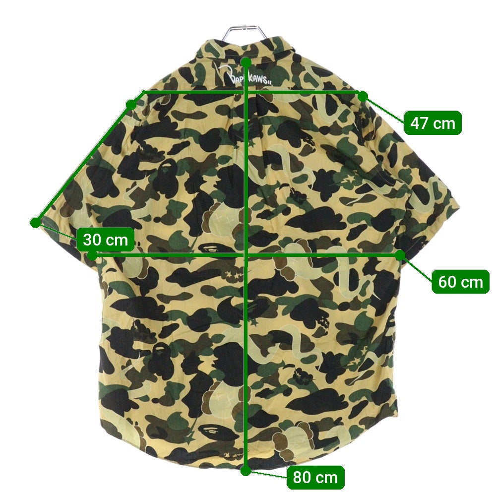 A BATHING APE(アベイシングエイプ) ×KAWS bendy 1st camo yellow S/S SHITS カウズ 迷彩 カモ柄 半袖シャツ マルチカラー