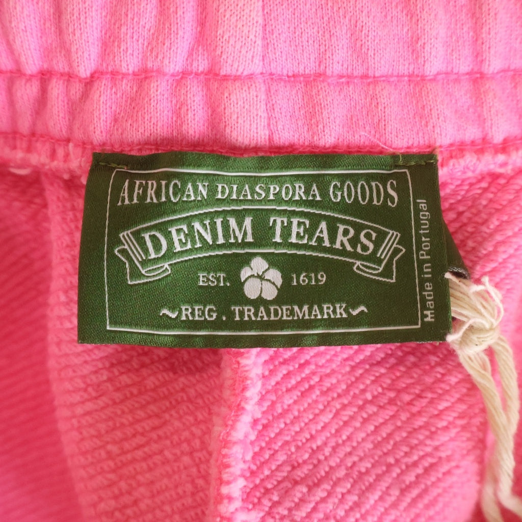 DENIM TEARS(デニムティアーズ) 25SS MONO COTTON WREATH SWEAT SHORTS スウェット ショートパンツ ピンク SS25BRS061