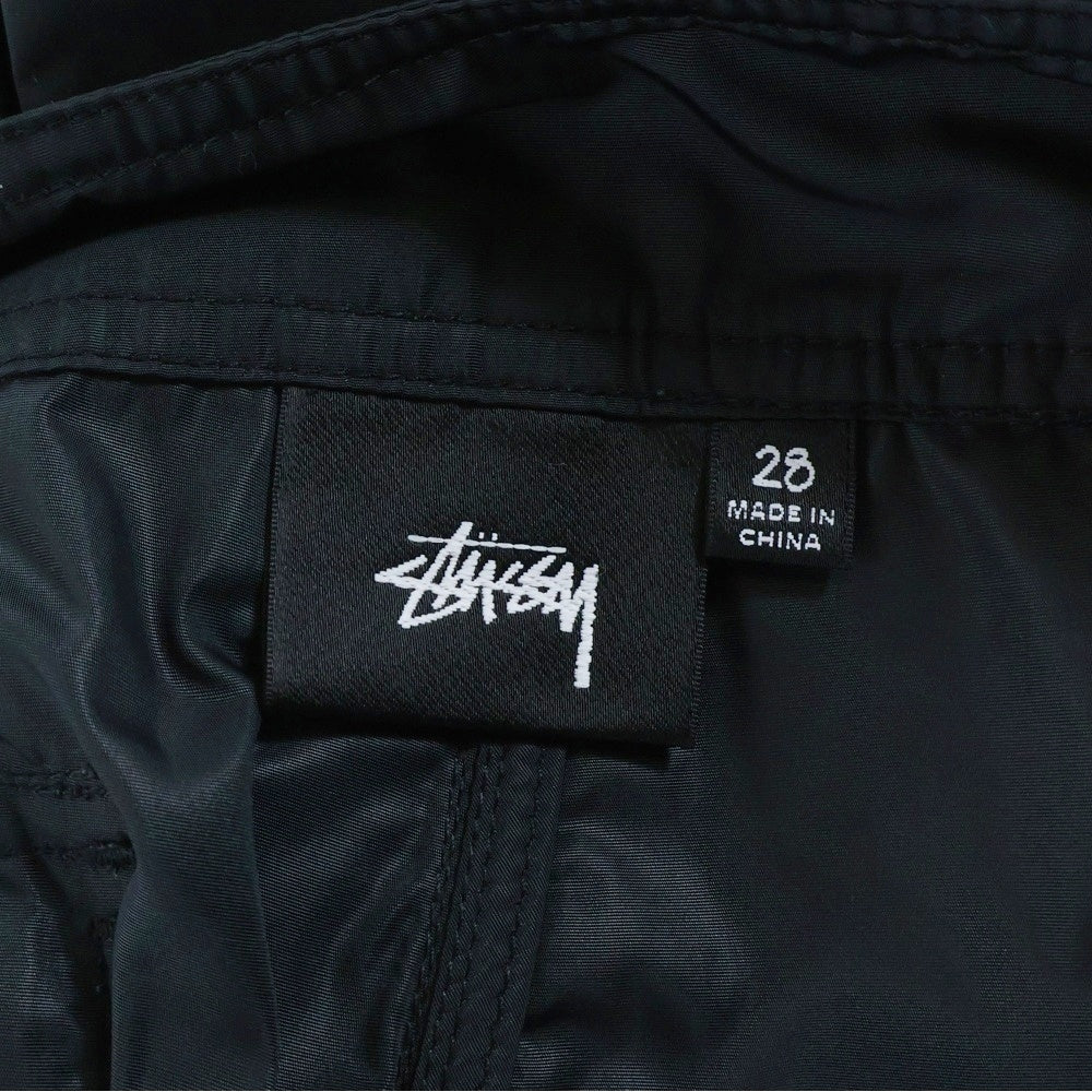 STUSSY(ステューシー) サーフマン ロゴ刺繍 ナイロン ハーフ ショートパンツ ショーツ ブラック