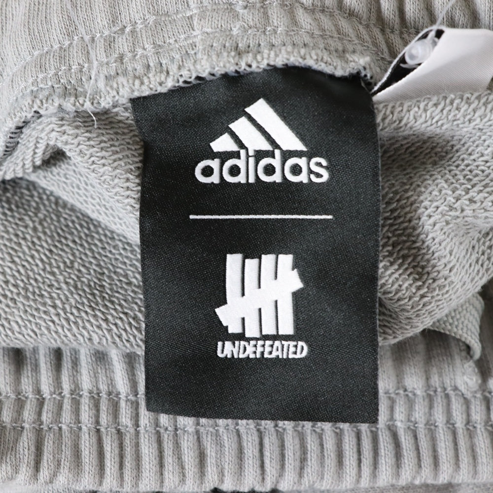adidas(アディダス) × UNDEFEATED アンディフィーテッド プリントデザイン スウェットパンツ グレー DN8777