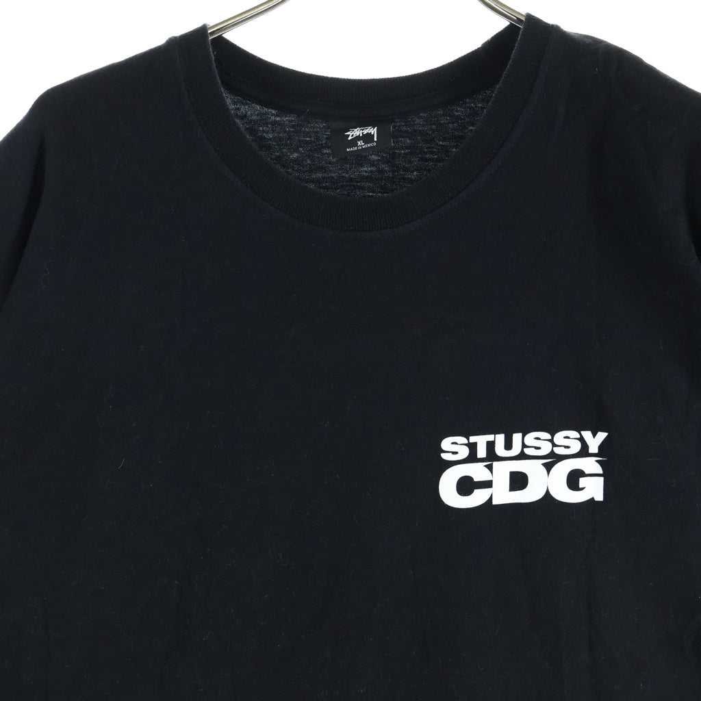 STUSSY(ステューシー) ×CDG SURFMAN TEE バックサーフマンプリント クルーネック半袖Tシャツカットソー ブラック