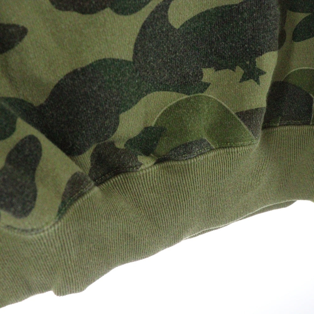 BAPE BY A BATHING APE(ベイプ ア ベイシング エイプ) ×KAWS bendy 1st camo green APE HEAD ×カウズ ベンディー ファーストカモエイプヘッド 総柄クルーネックスウェットトレーナー グリーン