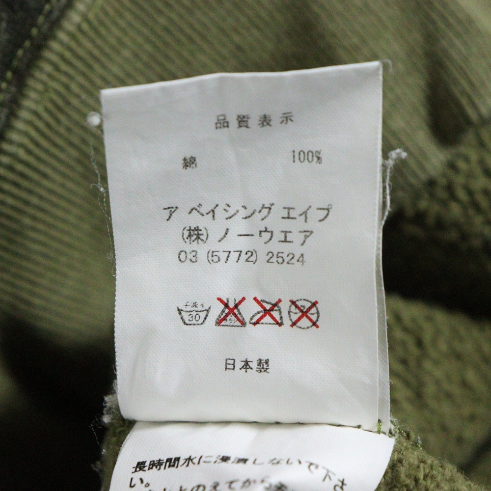 BAPE BY A BATHING APE(ベイプ ア ベイシング エイプ) ×KAWS bendy 1st camo green APE HEAD ×カウズ ベンディー ファーストカモエイプヘッド 総柄クルーネックスウェットトレーナー グリーン
