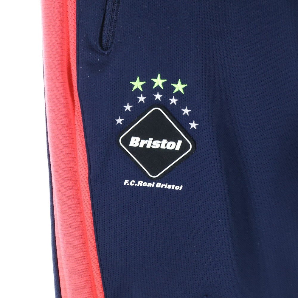 F.C.R.B./F.C.Real Bristol/FCRB(エフシーアールビー/エフシーレアルブリストル) PDK LONG PANTS ロゴパッチ付きサイドライントラックパンツ ネイビー/レッド FCRB-170005