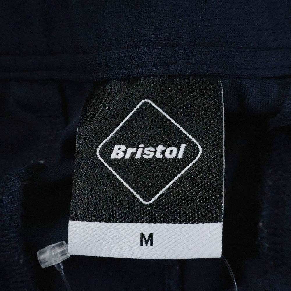 F.C.R.B./F.C.Real Bristol/FCRB(エフシーアールビー/エフシーレアルブリストル) PDK LONG PANTS ロゴパッチ付きサイドライントラックパンツ ネイビー/レッド FCRB-170005
