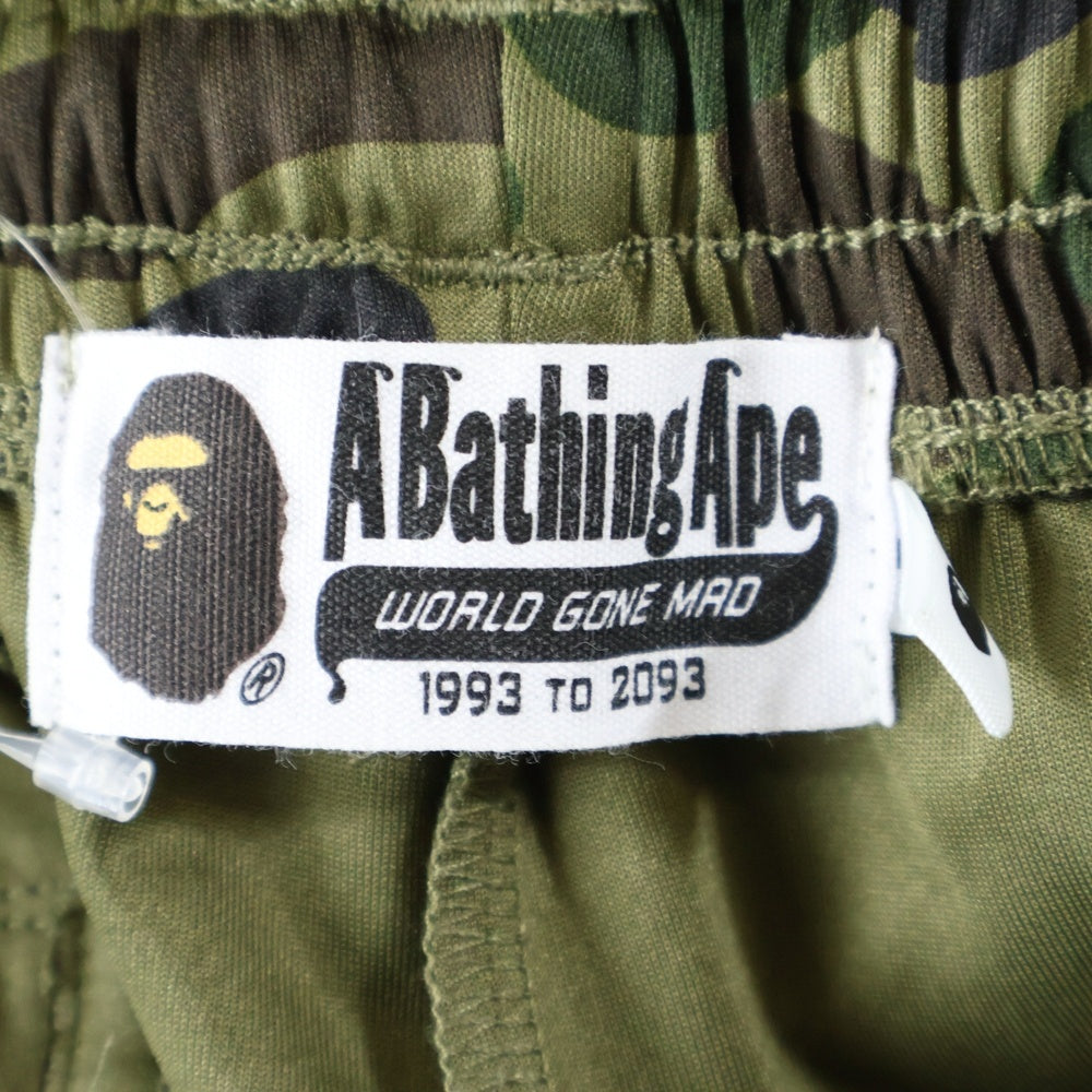 A BATHING APE(アベイシングエイプ) 1ST CAMO LOOSE FIT TRACK PANTS カモ総柄 エイプヘッドプリント ロゴサイドライン トラックパンツ グリーン 1L80-115-008