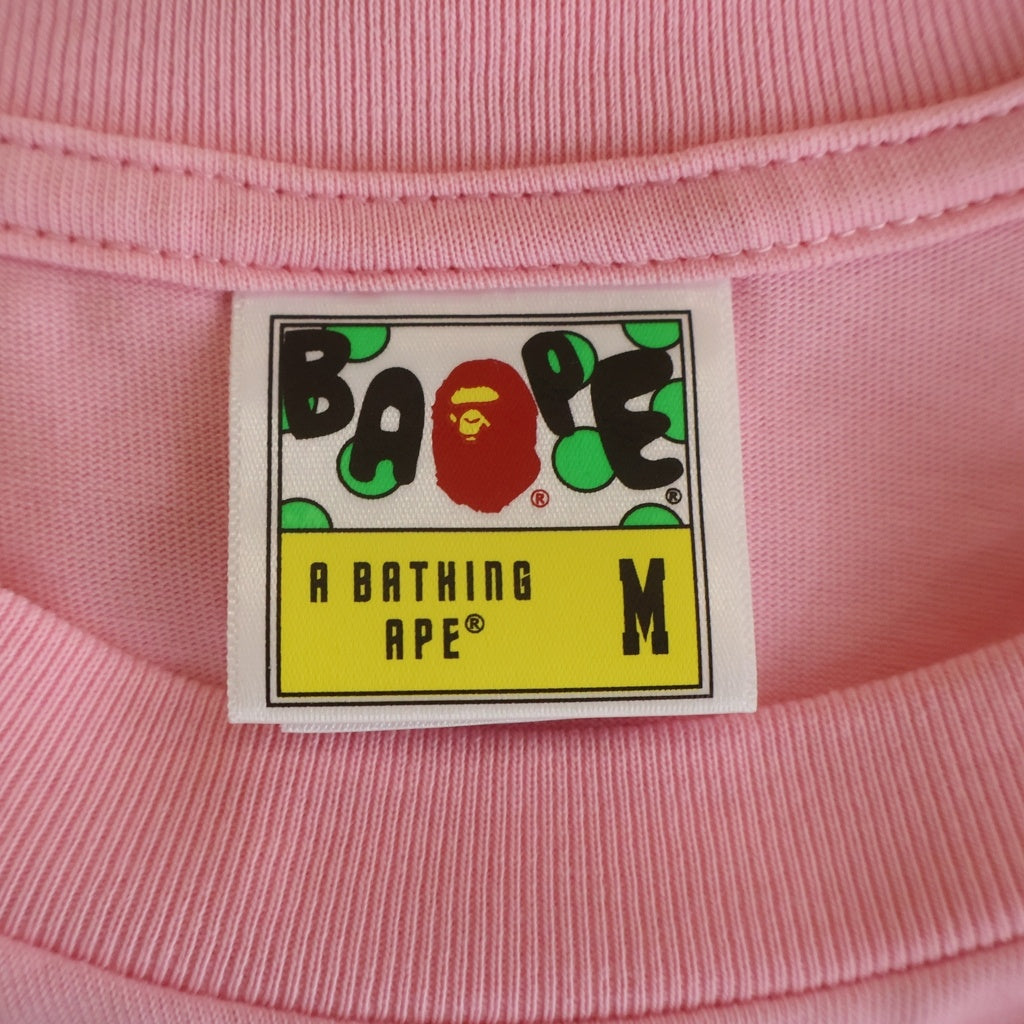 A BATHING APE(アベイシングエイプ) BABY MILO Ape Head ベイビーマイロ エイプヘッド フロントプリントクルーネック半袖Tシャツカットソー ピンク 002TEM301303M