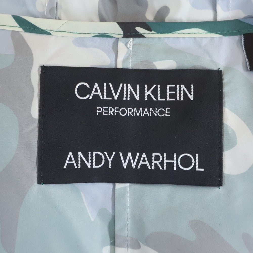 Calvin Klein(カルバンクライン) PERFORMANCE ANDY WARHOL パフォーマンス アンディーウォーホル カモ柄ポンチョ レインコート グリーン