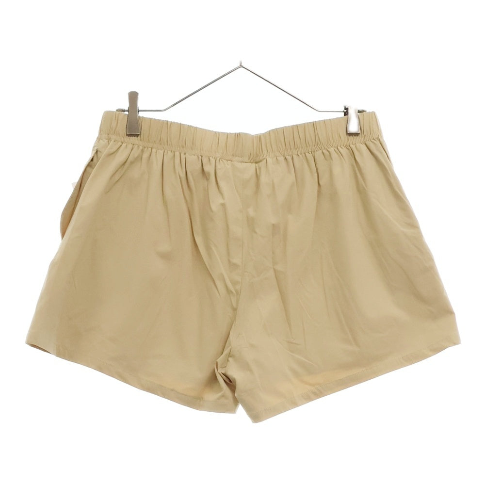 FEAR OF GOD ESSENTIALS(フィアオブゴッド エッセンシャルズ) SHORT PANTS ラバーロゴ ナイロンハーフパンツ ショーツ ベージュ