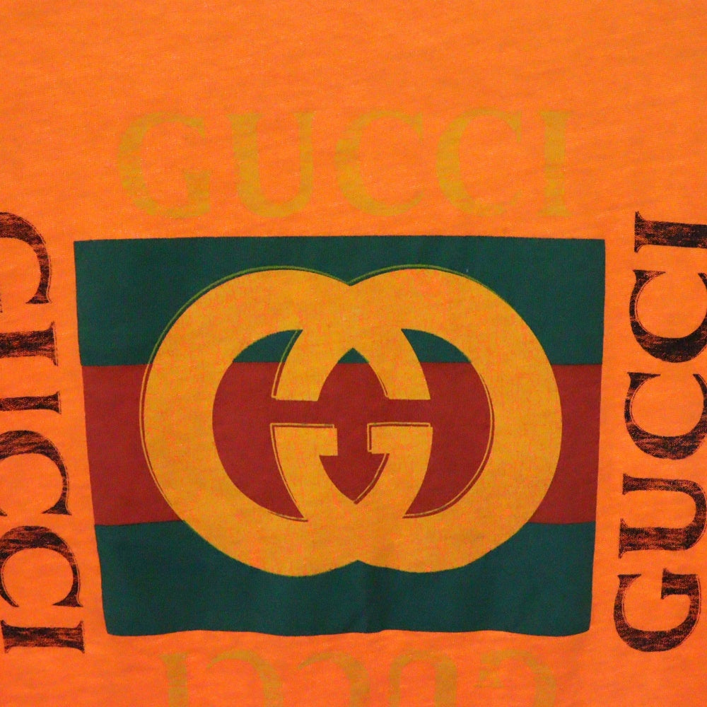 GUCCI(グッチ) グリッターロゴ ヴィンテージ加工 半袖Tシャツ オレンジ 493117 X3183