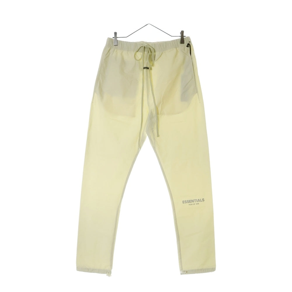 FEAR OF GOD ESSENTIALS(フィアオブゴッド エッセンシャルズ) NYLON PANTS リフレクターロゴ ナイロンパンツ アイボリー
