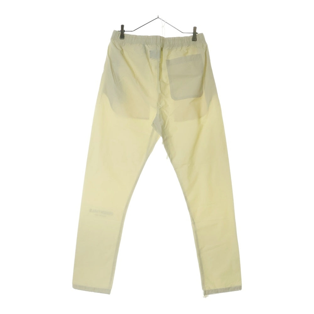 FEAR OF GOD ESSENTIALS(フィアオブゴッド エッセンシャルズ) NYLON PANTS リフレクターロゴ ナイロンパンツ アイボリー