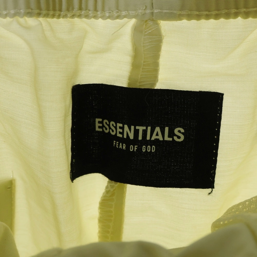 FEAR OF GOD ESSENTIALS(フィアオブゴッド エッセンシャルズ) NYLON PANTS リフレクターロゴ ナイロンパンツ アイボリー