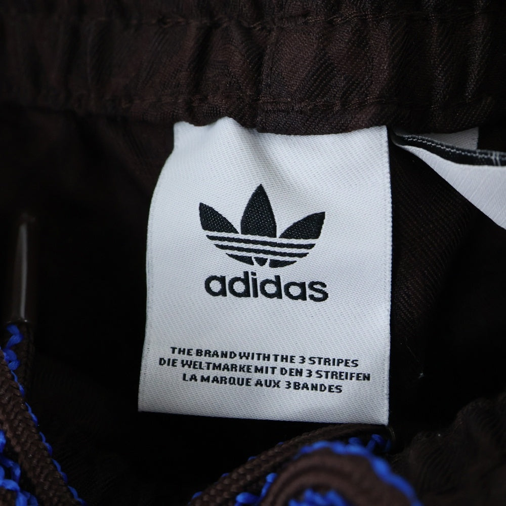 adidas(アディダス) LARGE CLUB TRACKPANTS 総柄トラックパンツ ブラウン JN5970