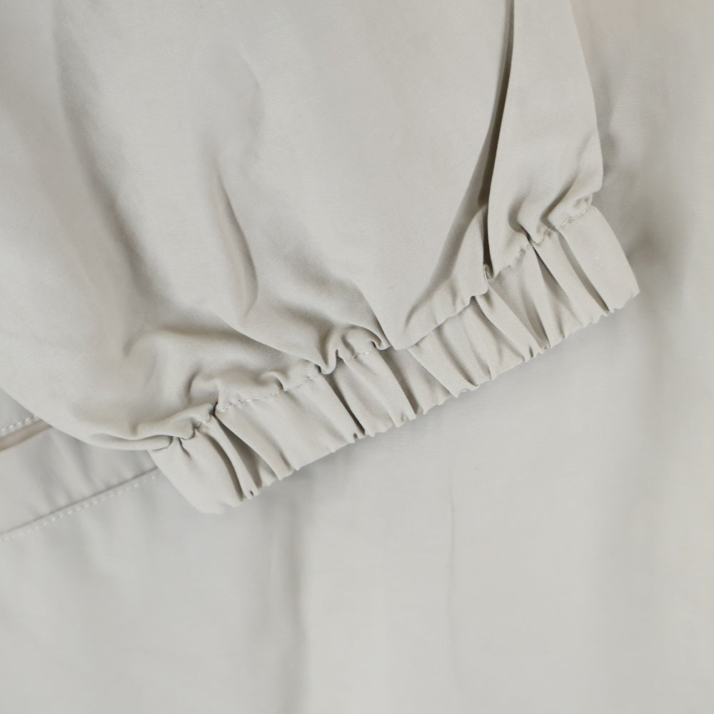FEAR OF GOD ESSENTIALS(フィアオブゴッド エッセンシャルズ) HALF ZIP NYLON JACKET リフレクターロゴ ハーフジップ ナイロンジャケット ベージュ