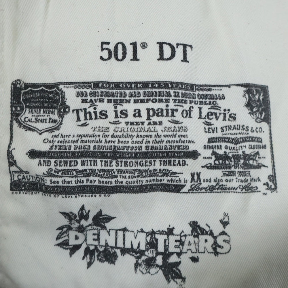 DENIM TEARS(デニムティアーズ) ×STUSSY ×OUR LEGACY Levi's 501 Denim Pants ステューシー アワーレガシー リーバイス 総柄デニムパンツ ホワイト
