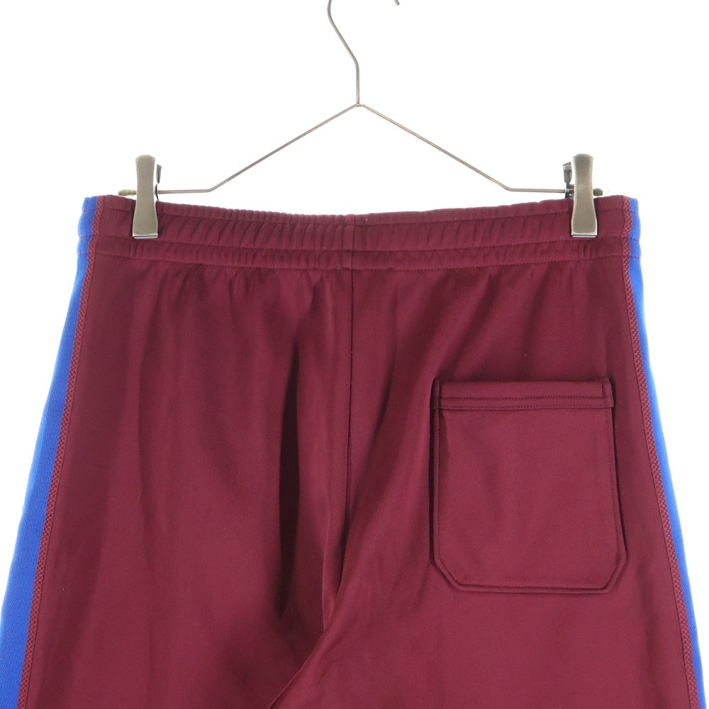Acne Studios(アクネ ストゥディオズ) サイドライン ドローコード トラックパンツ レッド
