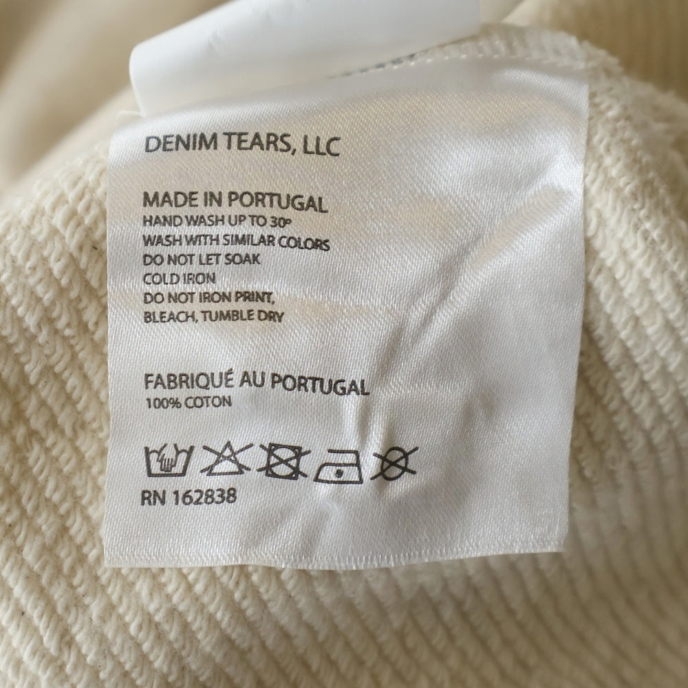 DENIM TEARS(デニムティアーズ) ラインストーン プリント スウェットパンツ アイボリー