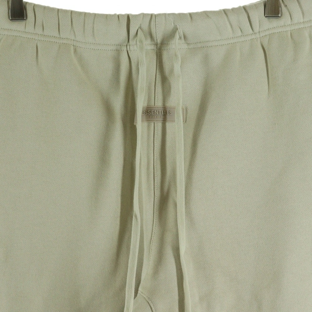 FEAR OF GOD ESSENTIALS(フィアオブゴッド エッセンシャルズ) ラバーロゴ ドローコード フリース スウェットパンツ アイボリー