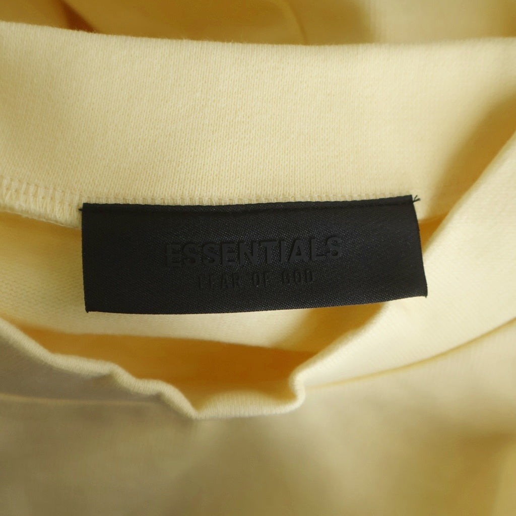 FEAR OF GOD ESSENTIALS(フィアオブゴッド エッセンシャルズ) Mock Neck L/S Tee モックネックロングスリーブTシャツ ラバーロゴ長袖Tシャツ イエロー