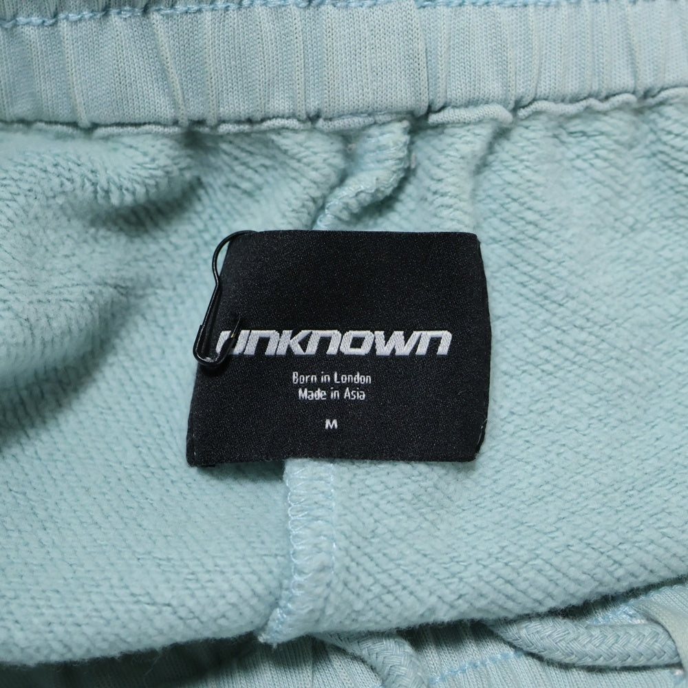 UNKNOWN LONDON(アンノーンロンドン) クロス ラインストーン スウェットパンツ ブルー