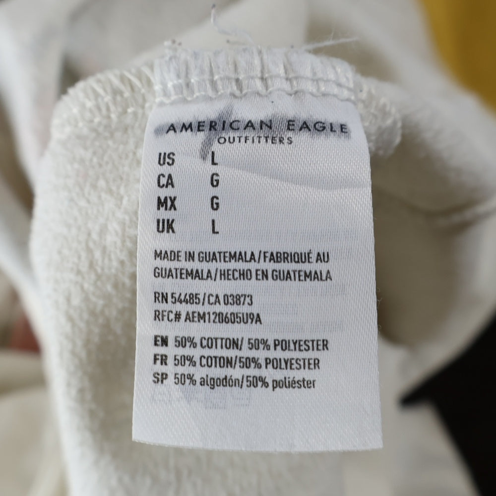 THE ROLLING STONES(ザ・ローリング・ストーンズ) リップタン フロント プリント ラグラン クルーネックトレーナー ホワイト/イエロー