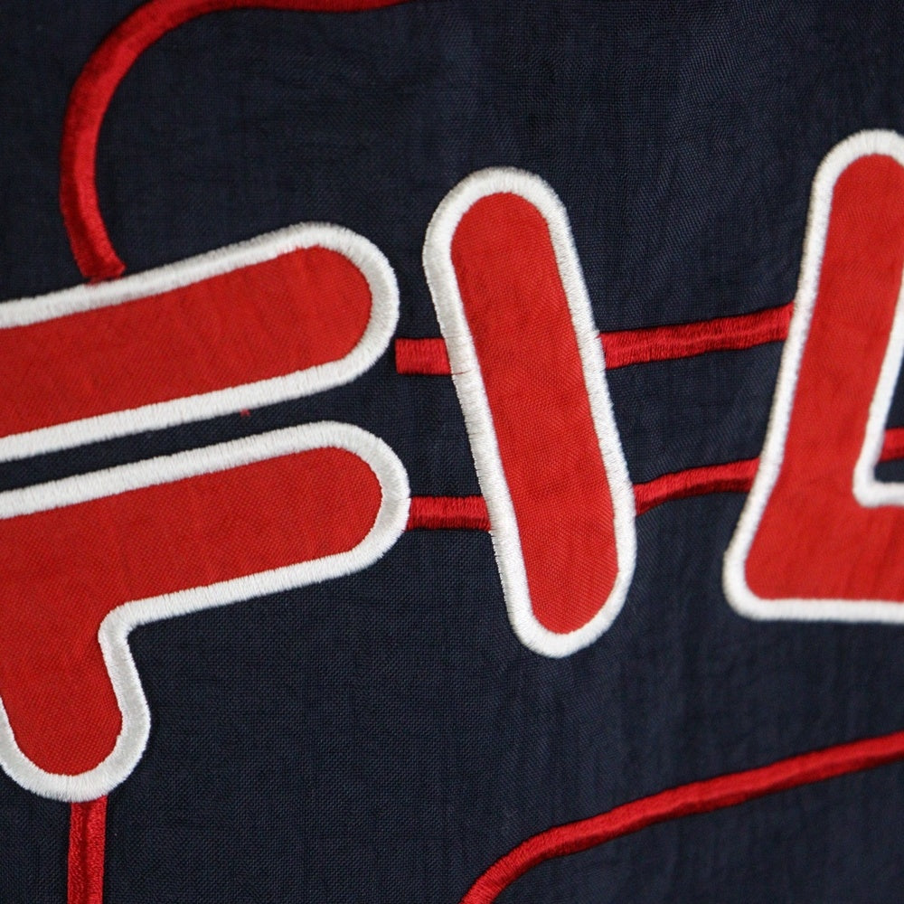 FILA(フィラ) 90s HALF ZIP JACKET 裏地ロゴ総柄 ハーフジップ 中綿ジャケット ネイビー/ホワイト