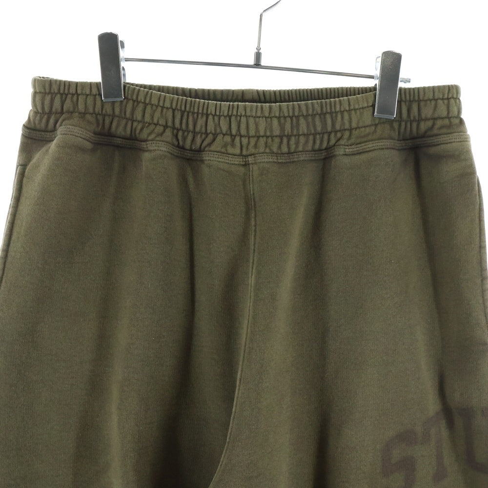 STUSSY(ステューシー) Fleece Pant Faded Graphic フェード加工 ロゴプリント フリース スウェットパンツ ブラウン 116667