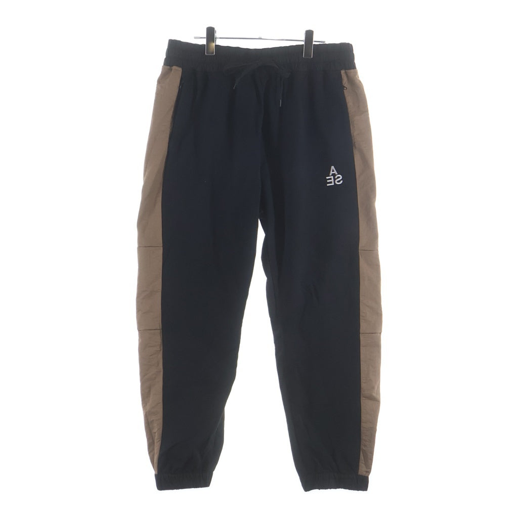 WIND AND SEA(ウィンダンシー) SWEAT TRUCK PANTS ロゴ刺繍 ナイロン トラックパンツ ブラックブラウン WDS-20A-PT-02