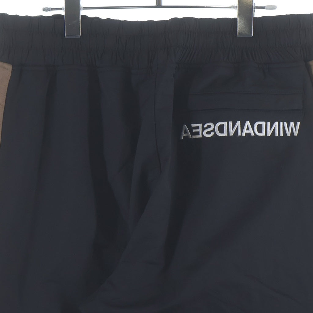 WIND AND SEA(ウィンダンシー) SWEAT TRUCK PANTS ロゴ刺繍 ナイロン トラックパンツ ブラックブラウン WDS-20A-PT-02