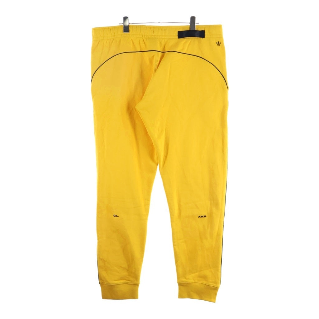 NIKE(ナイキ) 20AW ×DRAKE NOCTA NRG AU FLEECE PANT ドレイクノクタ ラバーロゴ フリース トラックパンツ イエロー DA3935-739
