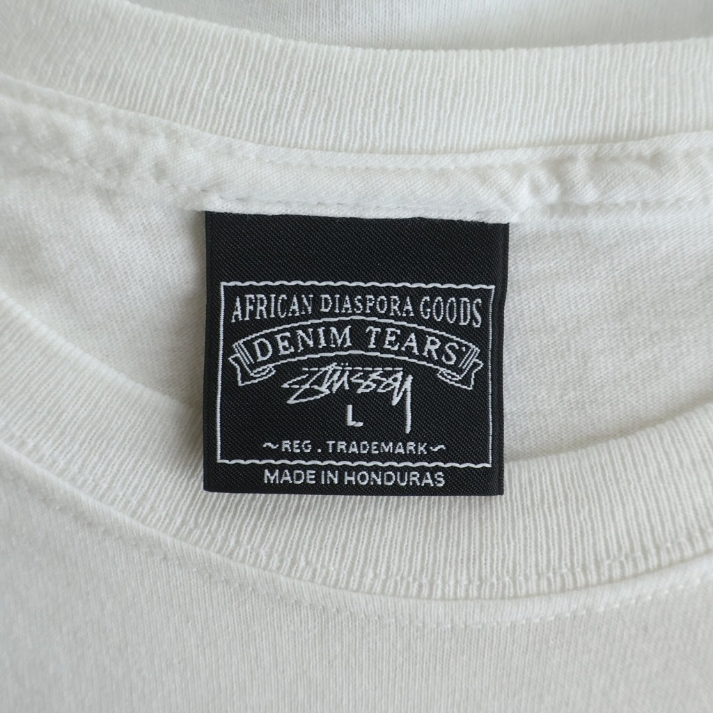 STUSSY(ステューシー) ×DENIM TEARS Annie Lee Tee デニムティアーズ アニーリー フロントプリント 半袖Tシャツ カットソー ホワイト