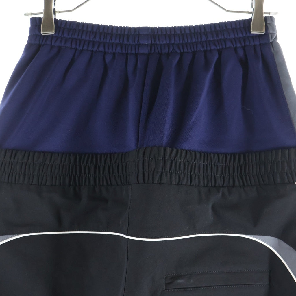 BALENCIAGA(バレンシアガ) 24AW CUT-UP TRACKSUIT PANTS ループスポーツロゴ カットアップ レイヤード トラックスーツ パンツ ブラック/ネイビー 808909 TR031