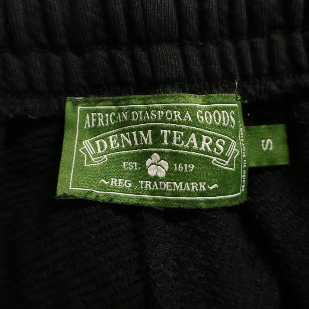 DENIM TEARS(デニムティアーズ) スウェットパンツ