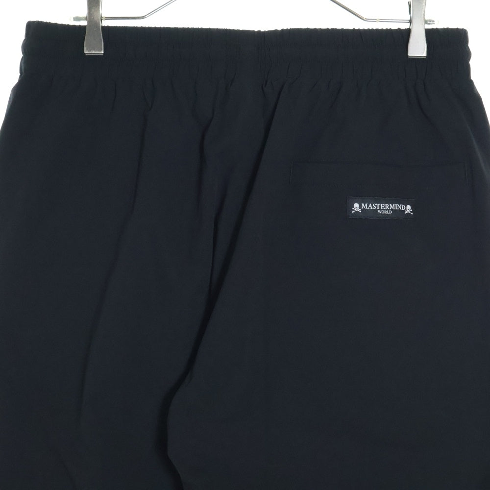 mastermind JAPAN(マスターマインドジャパン) 24SS×NEW ERA TRACK PANT ニューエラ ロゴプリントナイロントラックパンツ ブラック