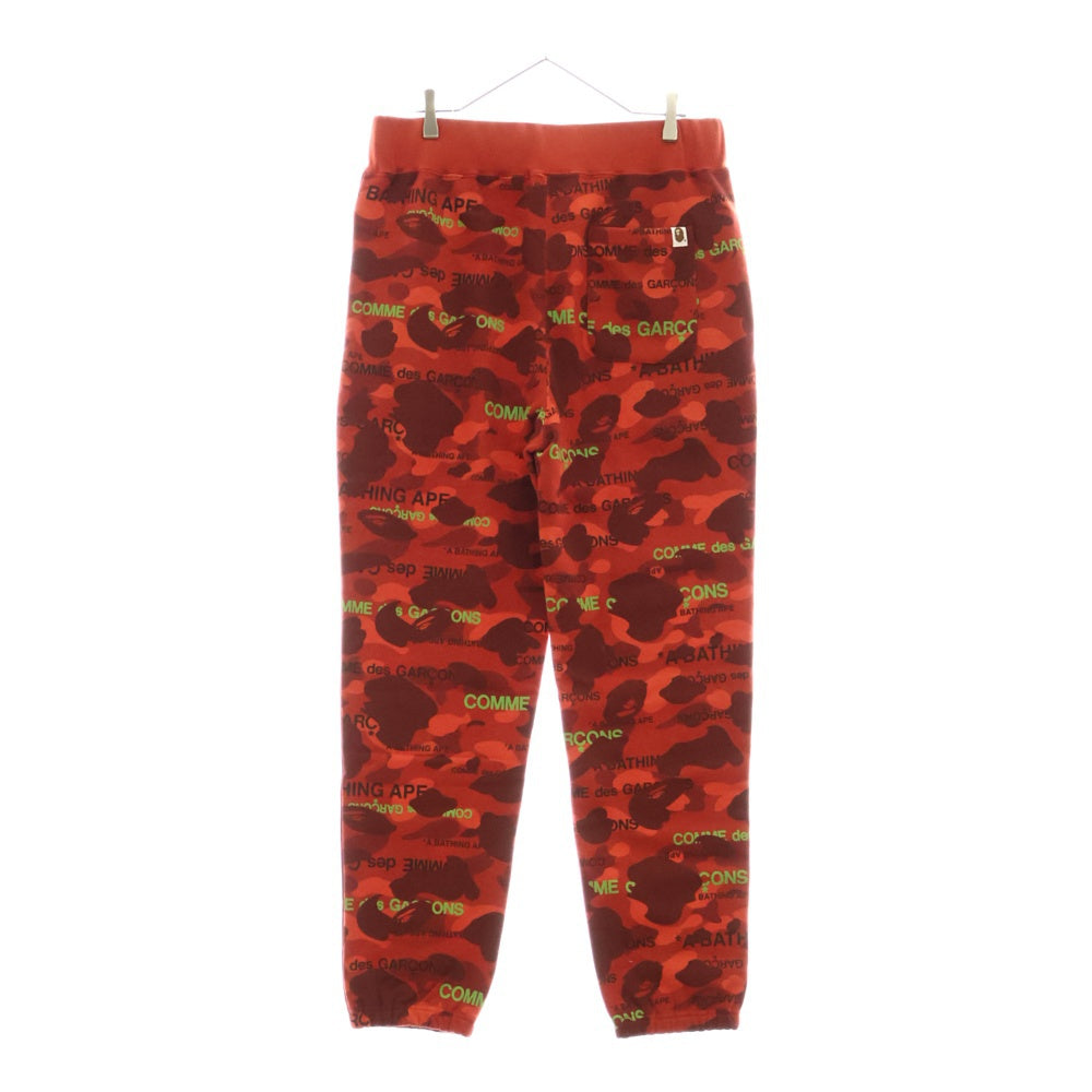 A BATHING APE(アベイシングエイプ) 22AW ×COMME des GARCONS コムデギャルソン カモ総柄 スウェットパンツ レッド 001PTI731901C