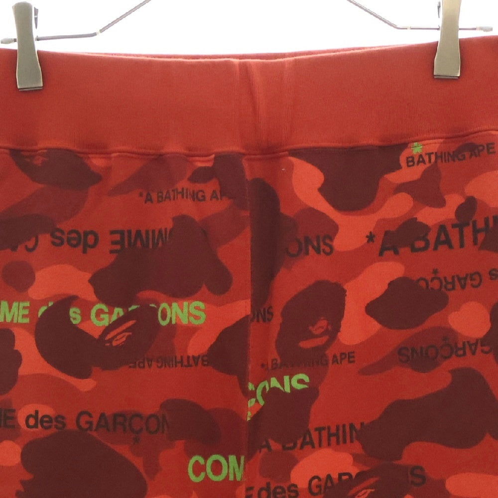 A BATHING APE(アベイシングエイプ) 22AW ×COMME des GARCONS コムデギャルソン カモ総柄 スウェットパンツ レッド 001PTI731901C