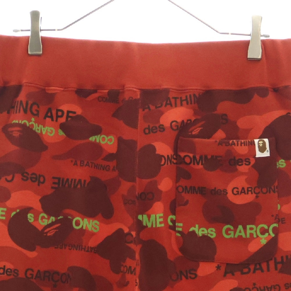 A BATHING APE(アベイシングエイプ) 22AW ×COMME des GARCONS コムデギャルソン カモ総柄 スウェットパンツ レッド 001PTI731901C